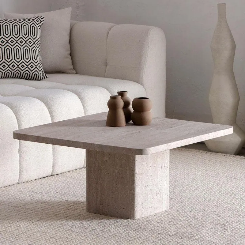 Table basse japandi carrée Muji en travertin à pied central